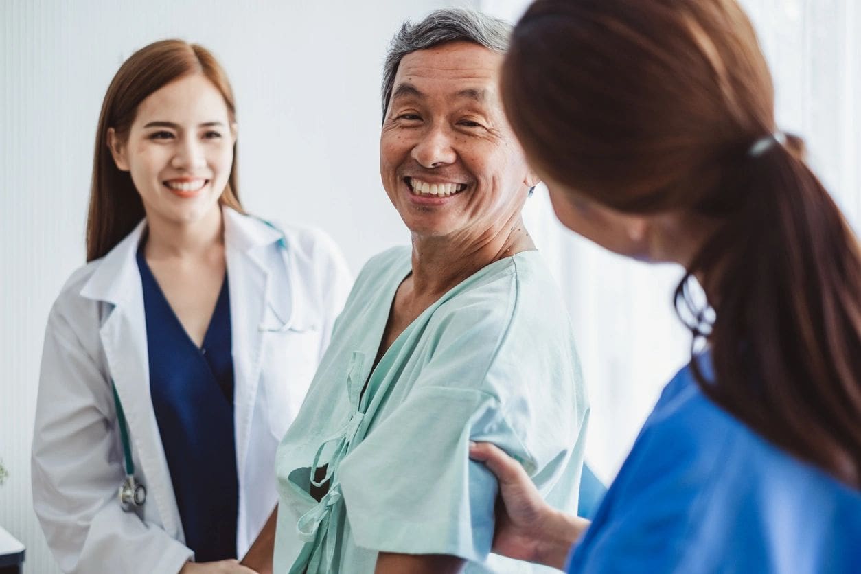 Asian doctor woman and nurse encourage disabled old man patient sitting on wheelchair at hospital, asian medical concept (Asian doctor woman and nurse encourage disabled old man patient sitting on wheelchair at hospital, asian medical concept, ASCII,